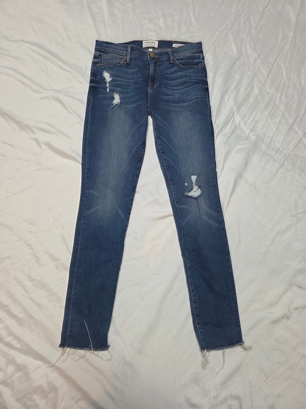 Frame Denim Indigo Skinny Jeans with Distressed Details